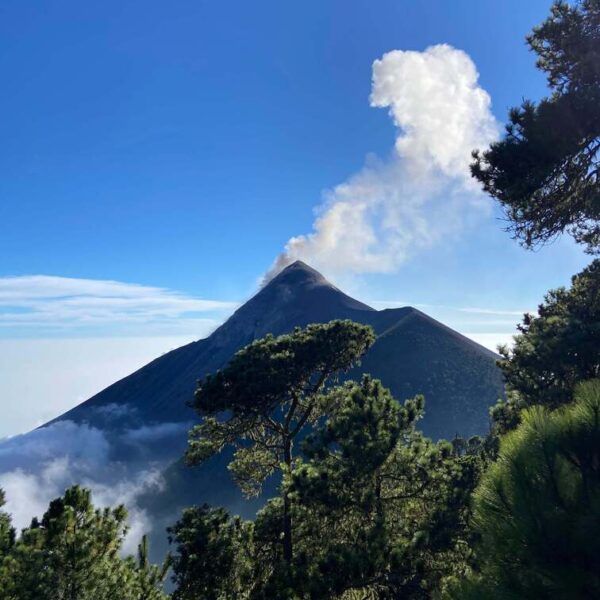 Frontal view of Acatenango Volcano with smoke on the top.