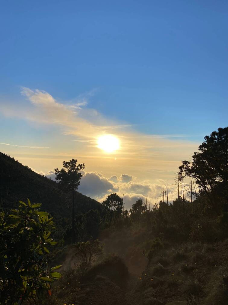 View of the sun and the cloud from the top of a mountain.