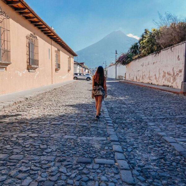 Cobbled street in Antigua with Volcan de Agua in the background.