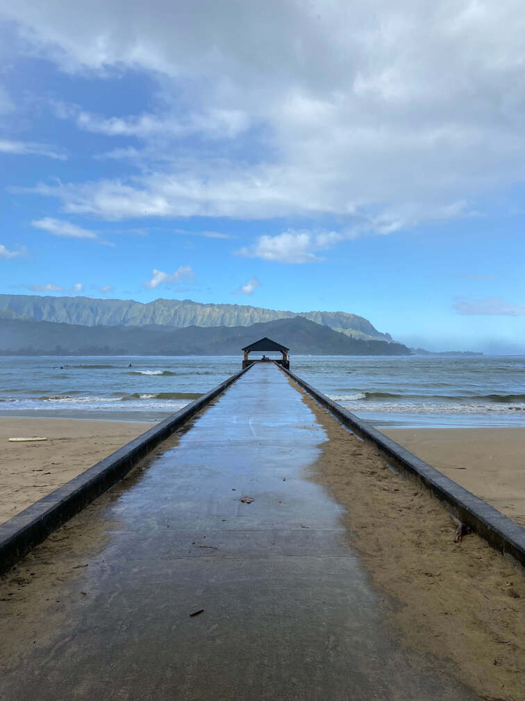 Hanalei pier: bridge over the water in the North Shore of Kauai.