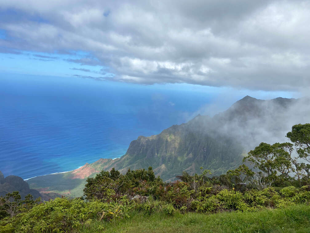 Aerial view of the Na Pali Coast in Kauai from the Kalalau Lookout Point.