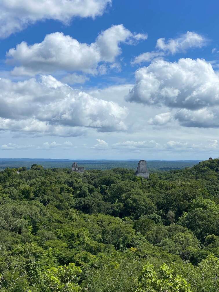 Aerial view of Tikal Ruins in the middle of the jungle.